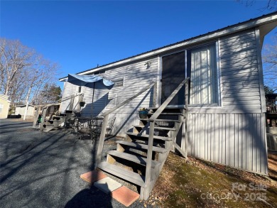 Welcome to Lake Life! This 1990 one bed/bath Park Model has been on Old North State Club at Uwharrie Point Golf community in North Carolina - for sale on GolfHomes.com, golf home, golf lot