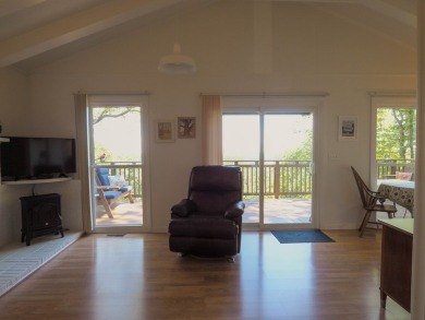 Welcome to a move-in ready charming cabin that is tucked into on Skyland Lakes Golf Course in Virginia - for sale on GolfHomes.com, golf home, golf lot