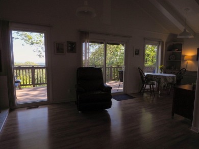 Welcome to a move-in ready charming cabin that is tucked into on Skyland Lakes Golf Course in Virginia - for sale on GolfHomes.com, golf home, golf lot