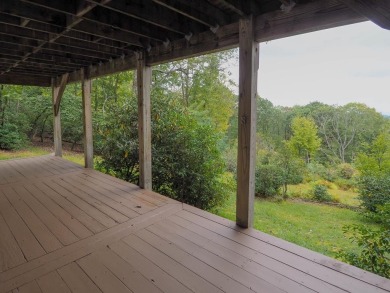 Welcome to a move-in ready charming cabin that is tucked into on Skyland Lakes Golf Course in Virginia - for sale on GolfHomes.com, golf home, golf lot