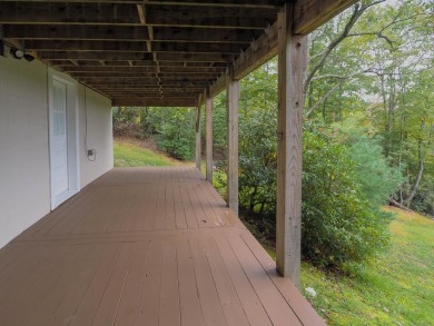 Welcome to a move-in ready charming cabin that is tucked into on Skyland Lakes Golf Course in Virginia - for sale on GolfHomes.com, golf home, golf lot