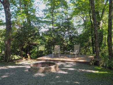 Welcome to a move-in ready charming cabin that is tucked into on Skyland Lakes Golf Course in Virginia - for sale on GolfHomes.com, golf home, golf lot