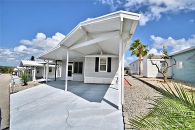 BEAUTIFUL FLORIDA OASIS located in a 55+ GATED community in the on Southern Dunes Golf and Country Club in Florida - for sale on GolfHomes.com, golf home, golf lot