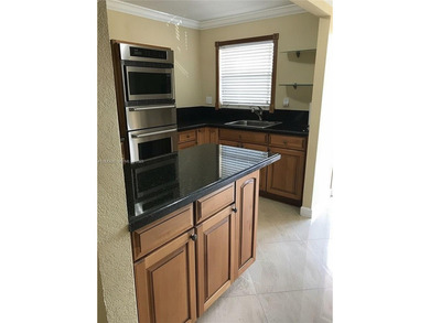 Enjoy peaceful 55+ living in this well-kept 2-bed, 2-bath condo on Sunrise Lakes Phase IV Golf Course in Florida - for sale on GolfHomes.com, golf home, golf lot