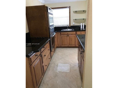 Enjoy peaceful 55+ living in this well-kept 2-bed, 2-bath condo on Sunrise Lakes Phase IV Golf Course in Florida - for sale on GolfHomes.com, golf home, golf lot