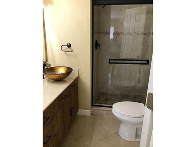 Enjoy peaceful 55+ living in this well-kept 2-bed, 2-bath condo on Sunrise Lakes Phase IV Golf Course in Florida - for sale on GolfHomes.com, golf home, golf lot