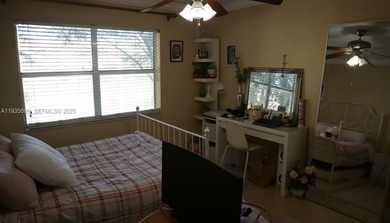 Enjoy peaceful 55+ living in this well-kept 2-bed, 2-bath condo on Sunrise Lakes Phase IV Golf Course in Florida - for sale on GolfHomes.com, golf home, golf lot