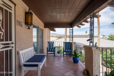 Wake up to peaceful lake views and vibrant sunsets at 565 Jones on London Bridge Golf Course in Arizona - for sale on GolfHomes.com, golf home, golf lot