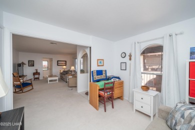 Wake up to peaceful lake views and vibrant sunsets at 565 Jones on London Bridge Golf Course in Arizona - for sale on GolfHomes.com, golf home, golf lot
