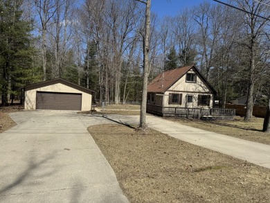 This charming 3-bedroom, 1-bath chalet-style home offers a on Birch Pointe Golf Club in Michigan - for sale on GolfHomes.com, golf home, golf lot