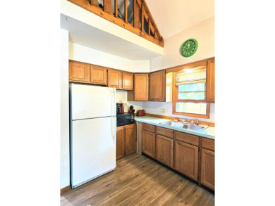 This charming 3-bedroom, 1-bath chalet-style home offers a on Birch Pointe Golf Club in Michigan - for sale on GolfHomes.com, golf home, golf lot
