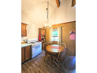 This charming 3-bedroom, 1-bath chalet-style home offers a on Birch Pointe Golf Club in Michigan - for sale on GolfHomes.com, golf home, golf lot
