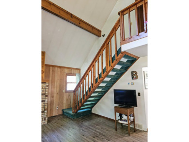 This charming 3-bedroom, 1-bath chalet-style home offers a on Birch Pointe Golf Club in Michigan - for sale on GolfHomes.com, golf home, golf lot