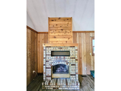 This charming 3-bedroom, 1-bath chalet-style home offers a on Birch Pointe Golf Club in Michigan - for sale on GolfHomes.com, golf home, golf lot
