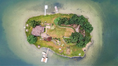 Discover unparalleled luxury on this exclusive private island on Battle Creek Country Club in Michigan - for sale on GolfHomes.com, golf home, golf lot