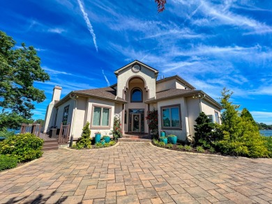 Discover unparalleled luxury on this exclusive private island on Battle Creek Country Club in Michigan - for sale on GolfHomes.com, golf home, golf lot