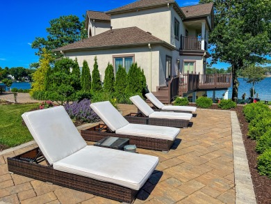 Discover unparalleled luxury on this exclusive private island on Battle Creek Country Club in Michigan - for sale on GolfHomes.com, golf home, golf lot