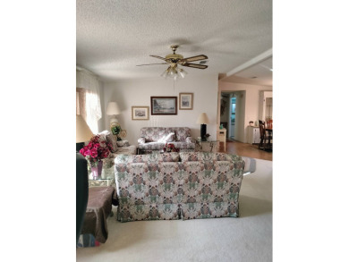 Don't miss this spacious, beautiful home in the highly on Lake Henry Golf Club in Florida - for sale on GolfHomes.com, golf home, golf lot