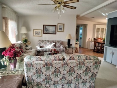 Don't miss this spacious, beautiful home in the highly on Lake Henry Golf Club in Florida - for sale on GolfHomes.com, golf home, golf lot