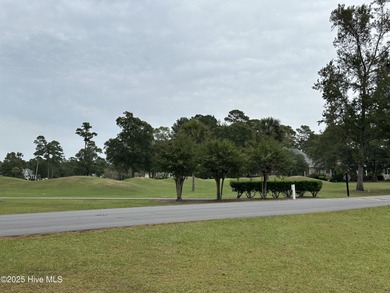 Build your dream home on this beautiful, large corner lot in on Brunswick Plantation and Golf Resorts in North Carolina - for sale on GolfHomes.com, golf home, golf lot