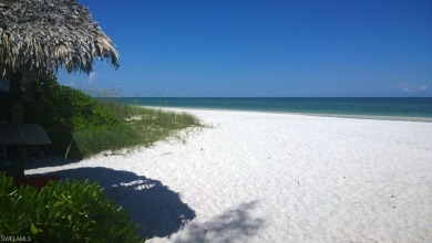 Panoramic lake and fairway views abound in this elegant on Cedar Hammock Golf and Country Club in Florida - for sale on GolfHomes.com, golf home, golf lot