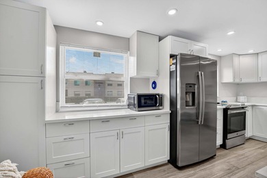 Well-planned, thoughtful renovations have created an open on Kings Point Golf -Flanders Way in Florida - for sale on GolfHomes.com, golf home, golf lot