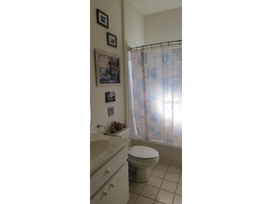 This charming 2-bedroom, 2-bath home is situated in the on Twisted Oaks Golf Club in Florida - for sale on GolfHomes.com, golf home, golf lot