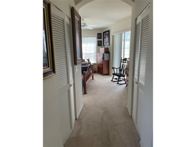 This charming 2-bedroom, 2-bath home is situated in the on Twisted Oaks Golf Club in Florida - for sale on GolfHomes.com, golf home, golf lot