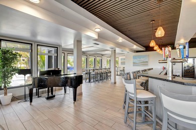 This beautifully maintained 1-bedroom, 1-bath residence offers on Ocean Village Golf Course in Florida - for sale on GolfHomes.com, golf home, golf lot