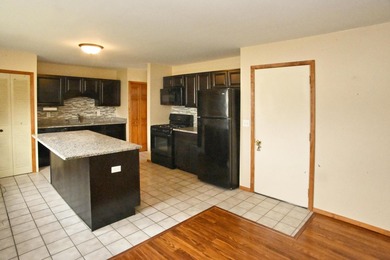 Welcome to this charming ranch home in Lakes of the Four Seasons on Lakes of the Four Seasons Country Club in Indiana - for sale on GolfHomes.com, golf home, golf lot