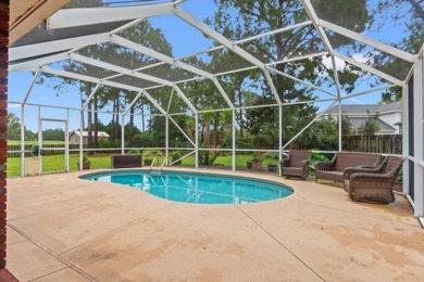 Step right up to this four-bedroom, three-bathroom gem nestled on Emerald Bay Golf Club in Florida - for sale on GolfHomes.com, golf home, golf lot