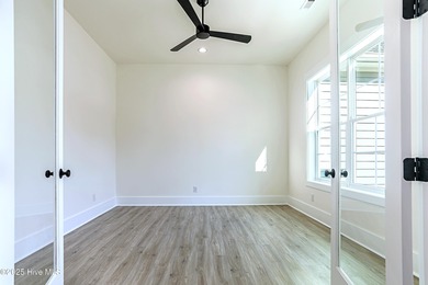 Cradled by the gentle currents where the Shallotte River meets on Lockwood Folly Country Club in North Carolina - for sale on GolfHomes.com, golf home, golf lot