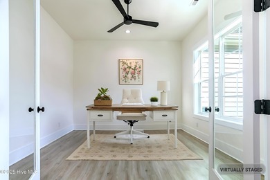 Cradled by the gentle currents where the Shallotte River meets on Lockwood Folly Country Club in North Carolina - for sale on GolfHomes.com, golf home, golf lot