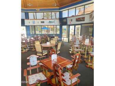 Bright and cheerful 3 bedroom corner unit overlooks marsh and on Harbour Village Golf and Yacht Club in Florida - for sale on GolfHomes.com, golf home, golf lot
