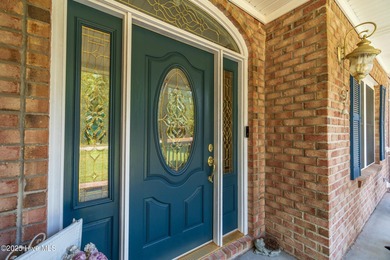 This beautifully maintained brick ranch is ready for its next on Sound Golf Links at Albemarle Plantation in North Carolina - for sale on GolfHomes.com, golf home, golf lot
