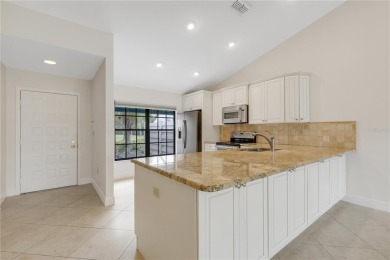 Expansive Golf Course views captures your attention as soon as on University Park Country Club in Florida - for sale on GolfHomes.com, golf home, golf lot