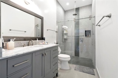 This is unbeatable Boca value! Oversized 17,049 SF lot + newer on Woodfield Country Club in Florida - for sale on GolfHomes.com, golf home, golf lot