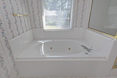 This charming 3-bedroom, 2.5-bath home sits right on the golf on Maple Ridge Golf Club in Georgia - for sale on GolfHomes.com, golf home, golf lot