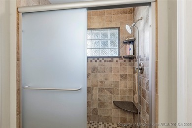 Waterfront home with stunning views located in the gated and on Carolina Trace Country Club in North Carolina - for sale on GolfHomes.com, golf home, golf lot