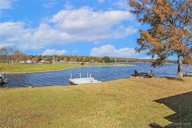 Waterfront home with stunning views located in the gated and on Carolina Trace Country Club in North Carolina - for sale on GolfHomes.com, golf home, golf lot