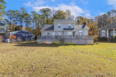 Waterfront home with stunning views located in the gated and on Carolina Trace Country Club in North Carolina - for sale on GolfHomes.com, golf home, golf lot