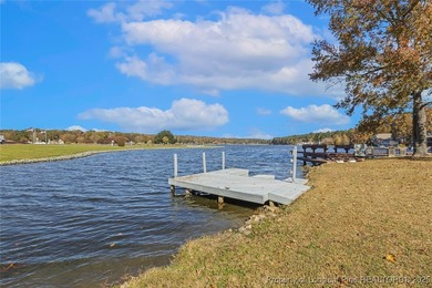 Waterfront home with stunning views located in the gated and on Carolina Trace Country Club in North Carolina - for sale on GolfHomes.com, golf home, golf lot