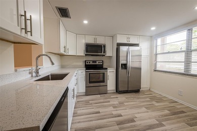 Nestled in the vibrant heart of Wynmoor, an adult community that on Wynmoor Golf Course in Florida - for sale on GolfHomes.com, golf home, golf lot