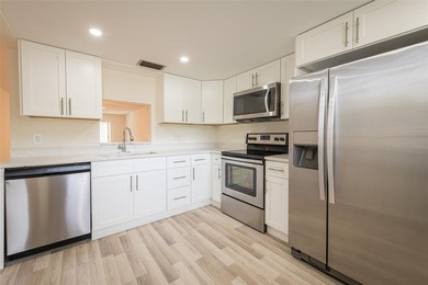 Nestled in the vibrant heart of Wynmoor, an adult community that on Wynmoor Golf Course in Florida - for sale on GolfHomes.com, golf home, golf lot