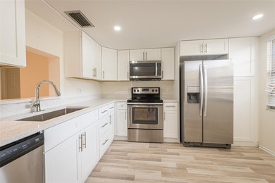 Nestled in the vibrant heart of Wynmoor, an adult community that on Wynmoor Golf Course in Florida - for sale on GolfHomes.com, golf home, golf lot