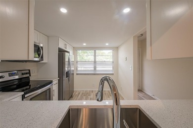 Nestled in the vibrant heart of Wynmoor, an adult community that on Wynmoor Golf Course in Florida - for sale on GolfHomes.com, golf home, golf lot