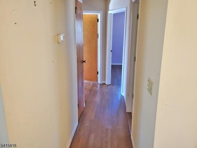 THIS RANCH BOASTS AN OPEN FLOOR PLAN WITH THE FORMAL LIVING ROOM on High Bridge Hills Golf Club in New Jersey - for sale on GolfHomes.com, golf home, golf lot