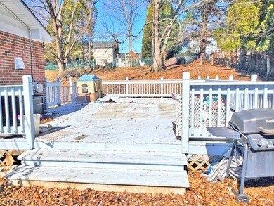 THIS RANCH BOASTS AN OPEN FLOOR PLAN WITH THE FORMAL LIVING ROOM on High Bridge Hills Golf Club in New Jersey - for sale on GolfHomes.com, golf home, golf lot