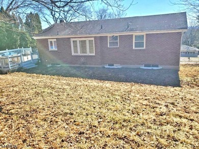 THIS RANCH BOASTS AN OPEN FLOOR PLAN WITH THE FORMAL LIVING ROOM on High Bridge Hills Golf Club in New Jersey - for sale on GolfHomes.com, golf home, golf lot