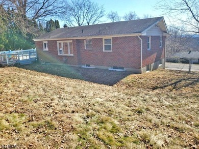 THIS RANCH BOASTS AN OPEN FLOOR PLAN WITH THE FORMAL LIVING ROOM on High Bridge Hills Golf Club in New Jersey - for sale on GolfHomes.com, golf home, golf lot